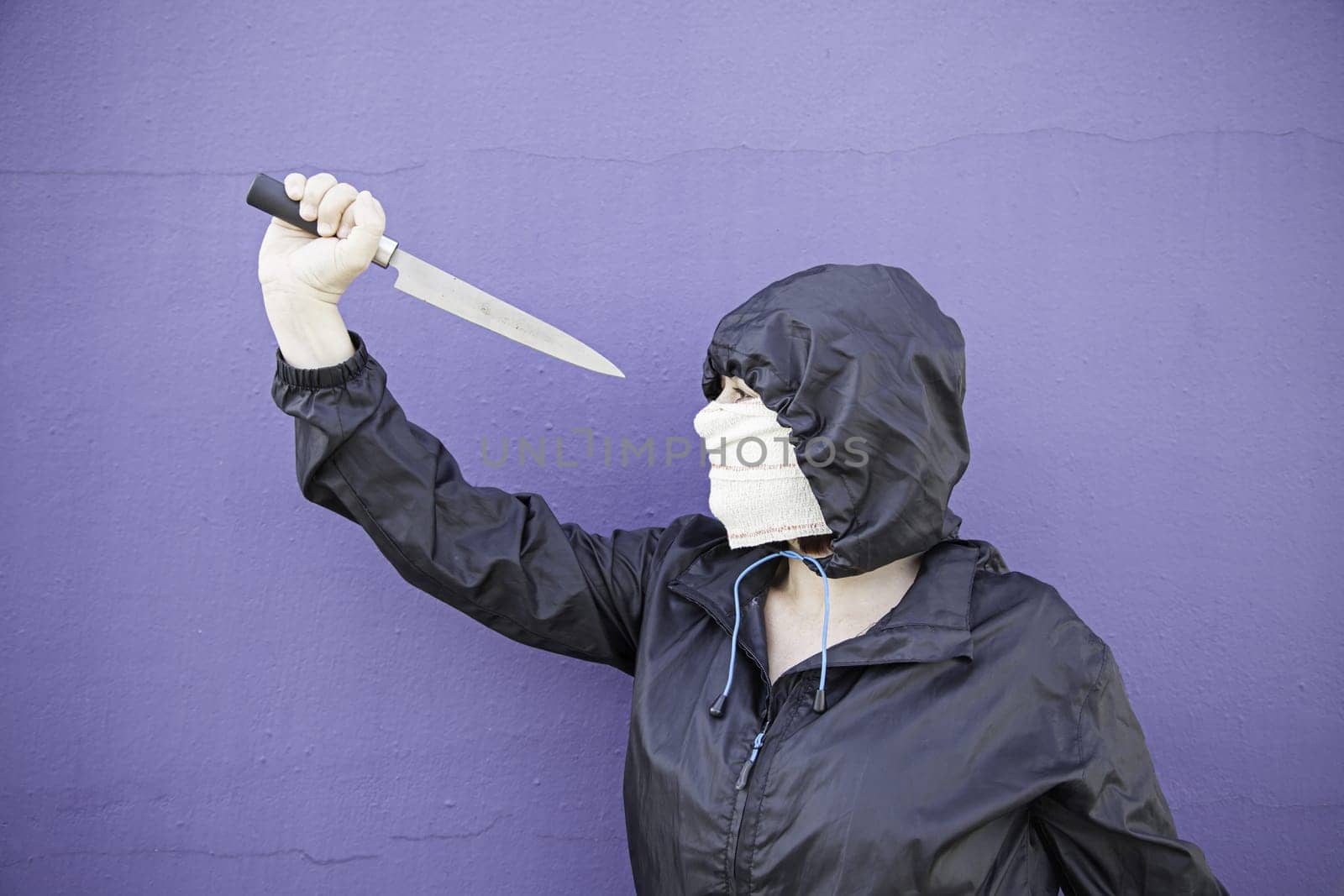 Aggressive hooded woman, violence and lifestyle