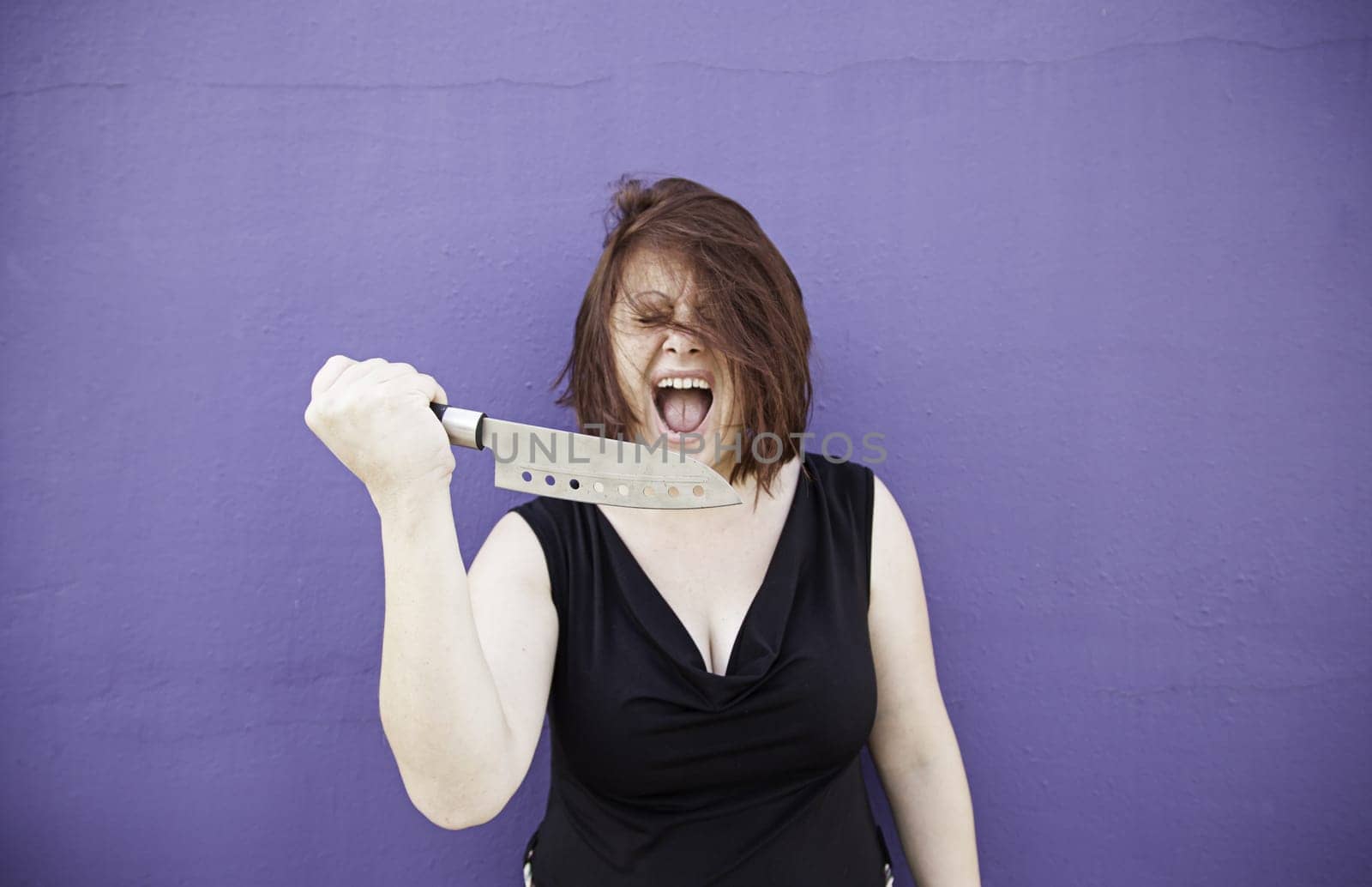 Crazy with knife screaming, violence and danger