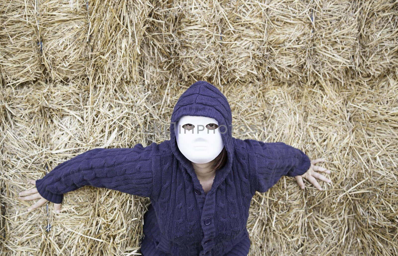Masked woman in barn farm, halloween