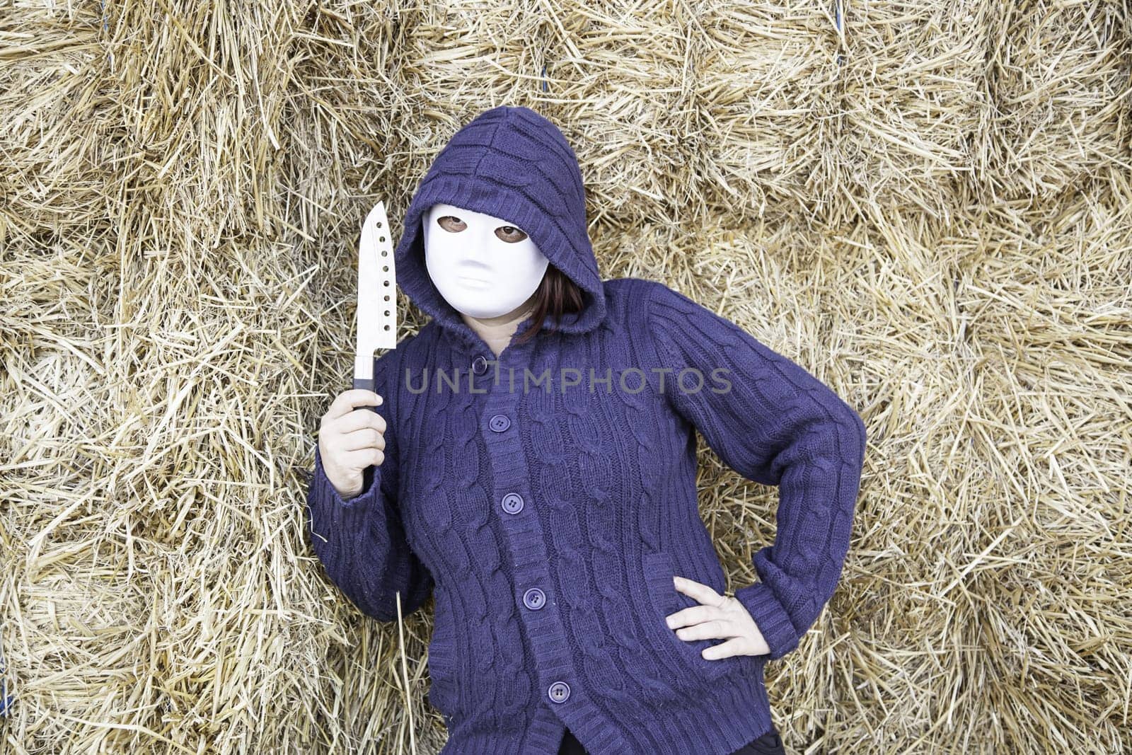 Masked woman in barn farm, halloween