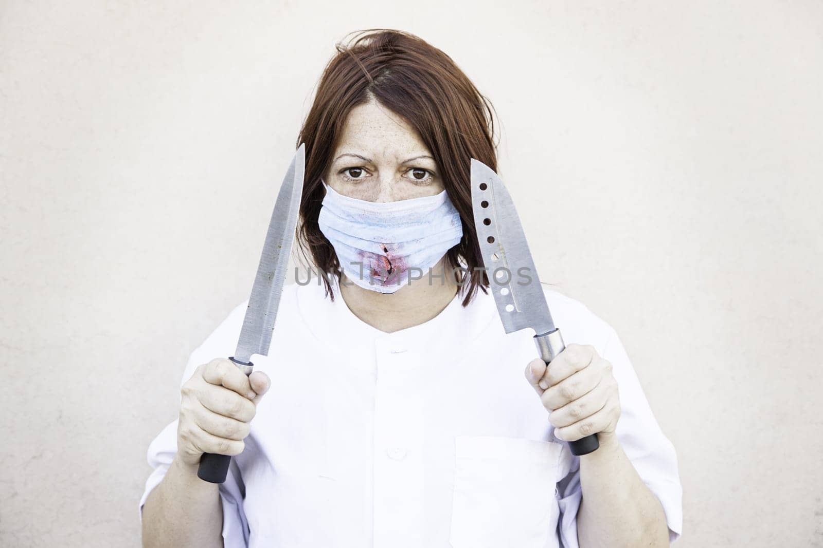 Nurse with knives and bloody mask, halloween