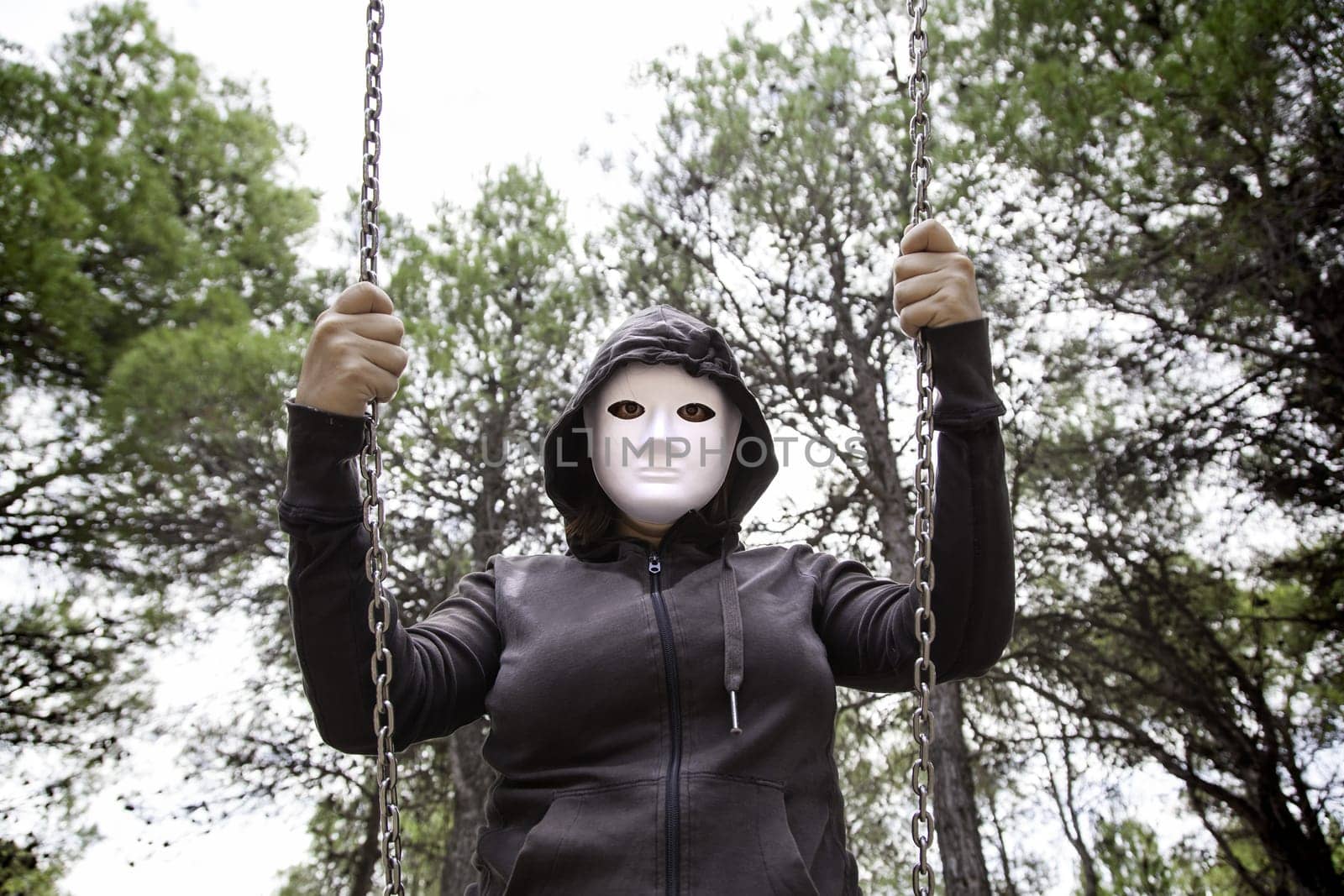 Aggressive hooded woman, violence and lifestyle