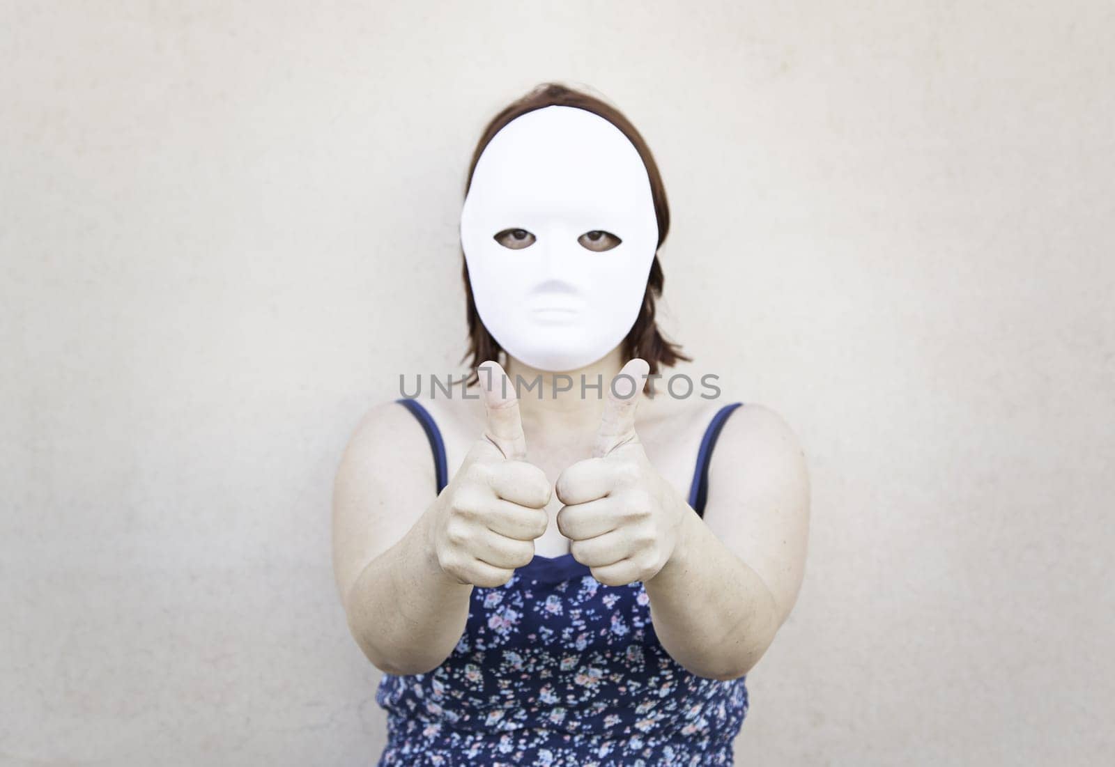 Girl in white mask on halloween, mystery