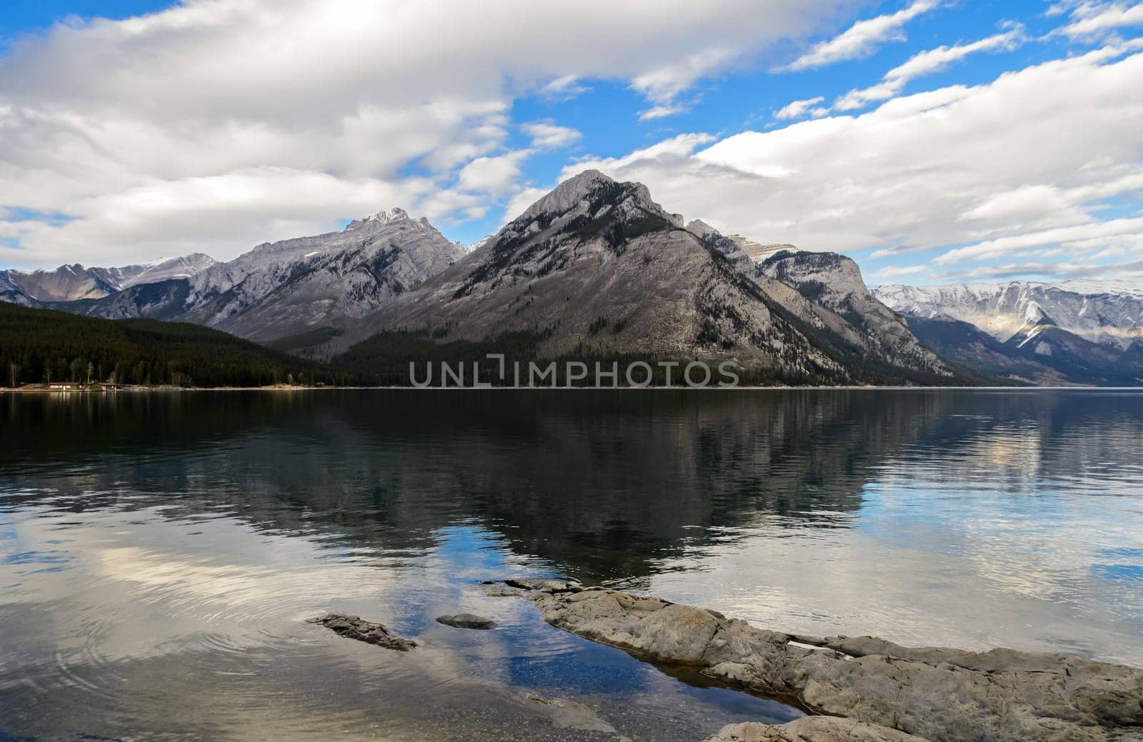 Reflection of Fairholme Range in Minnewanka Lake, Banff National Park in Alberta, Canada