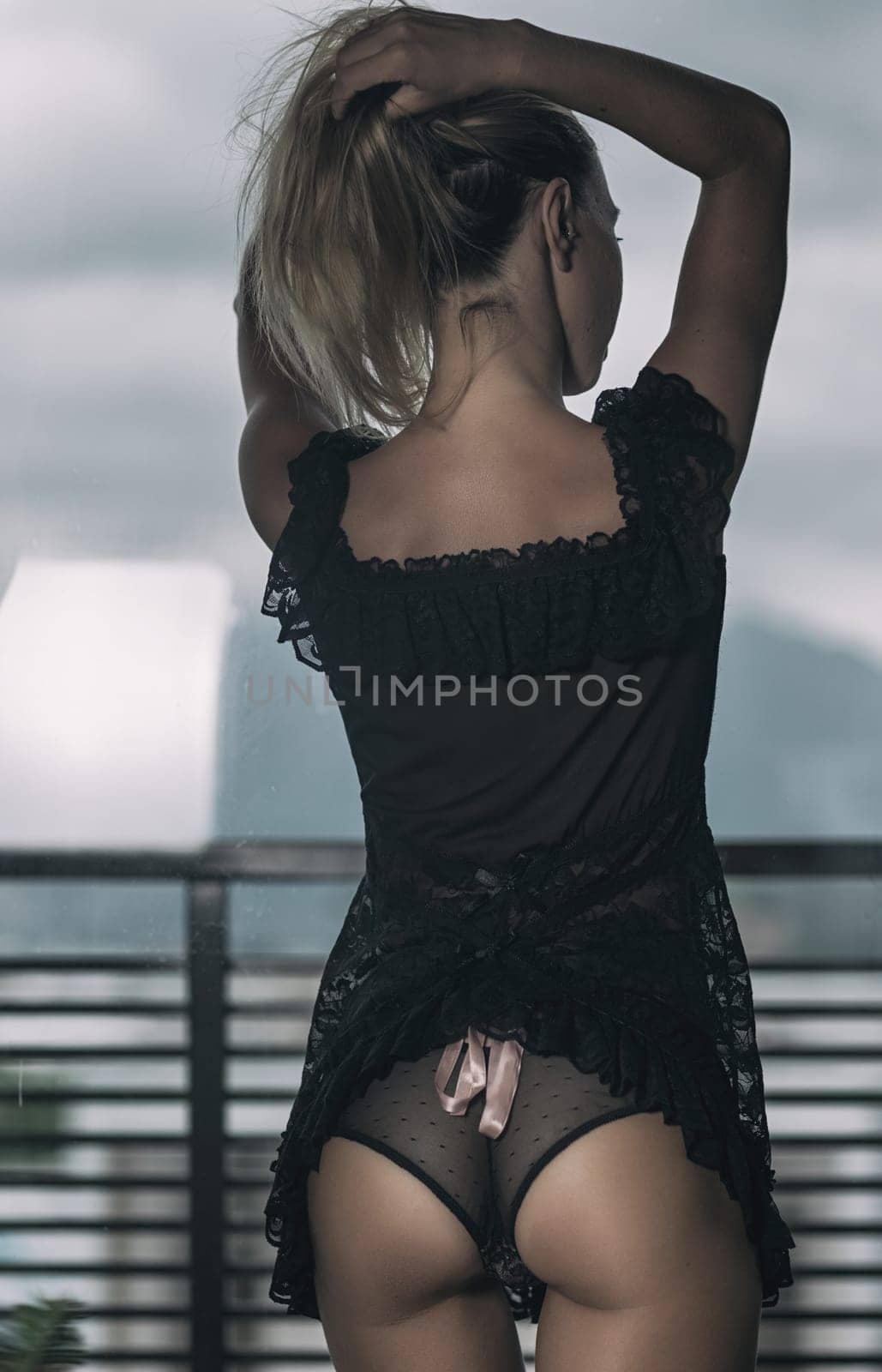 Beautiful woman posing at the window