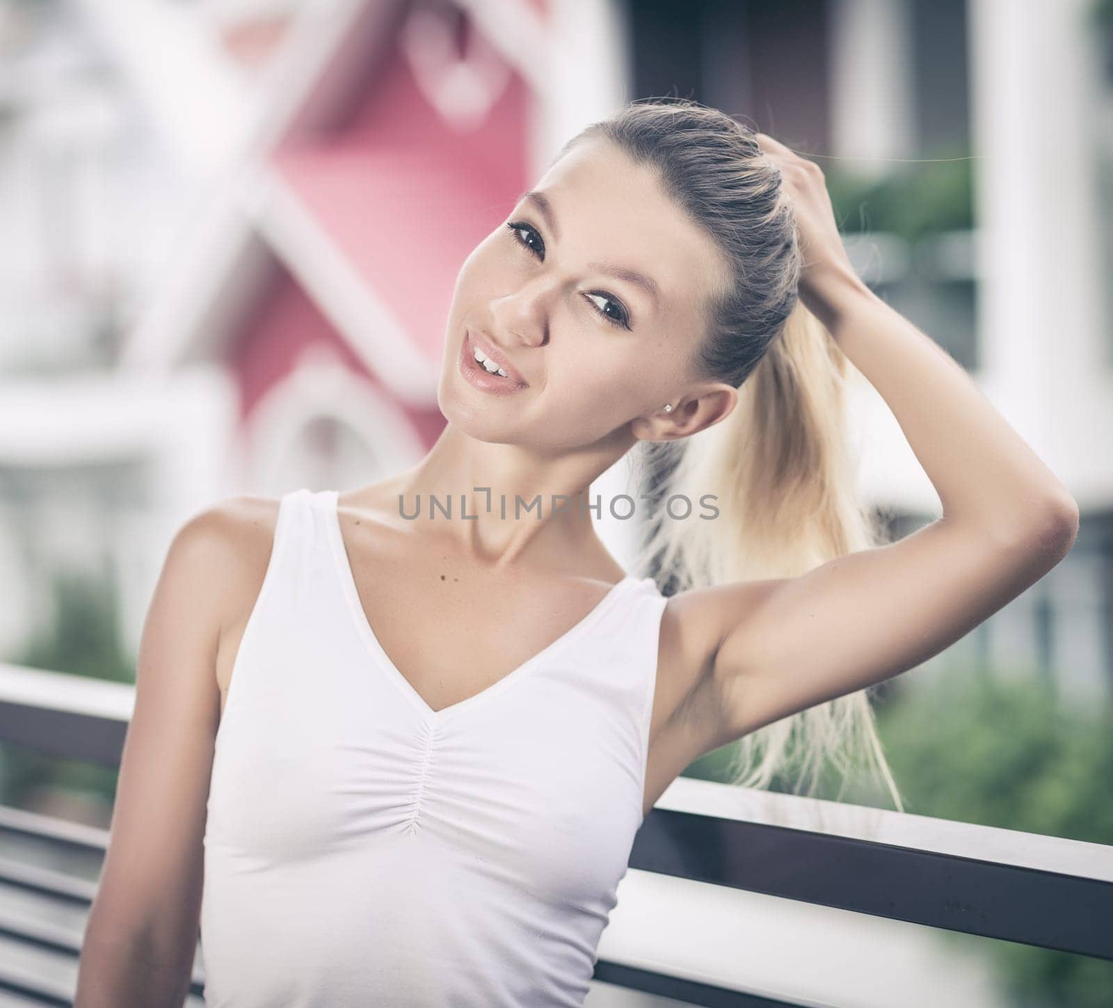 Beautiful woman posing at the balcony