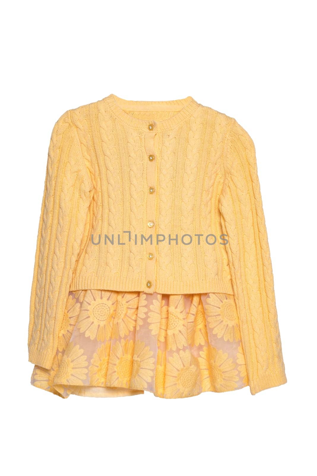 Girls clothes. Festive beautiful yellow little girl sweater or knitted cardigan and a matching yellow summer skirt isolated on a white background. Children and kids fashion.