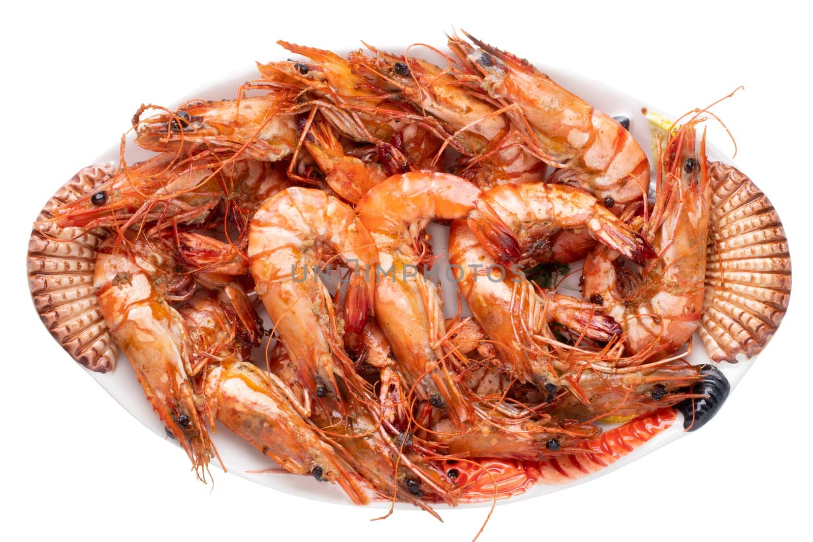 Seafood background. Closeup of fresh grilled big prawn tiger or shrimps on a colorful seafood plate isolated on a white background. Concept healthy food. BBQ.