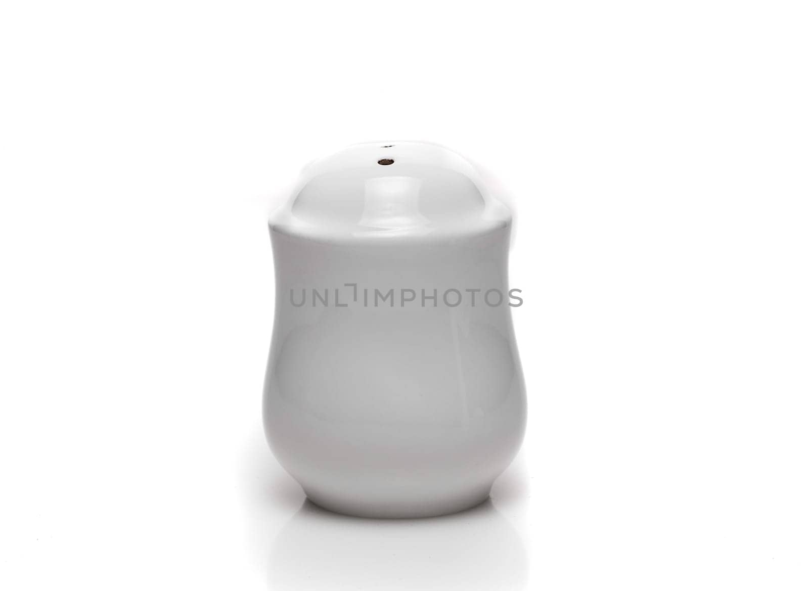 white dishes on a white background pepper
