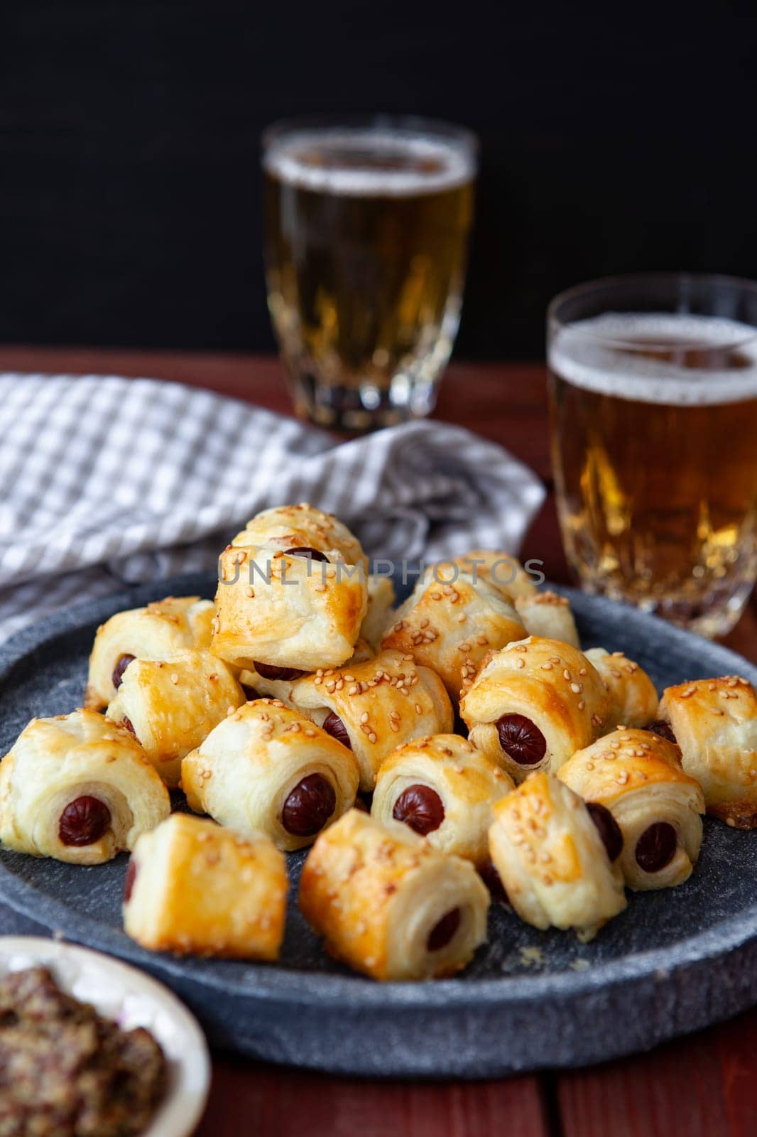 Savoury snack with puff pastry and sausages / pigs in a blanket