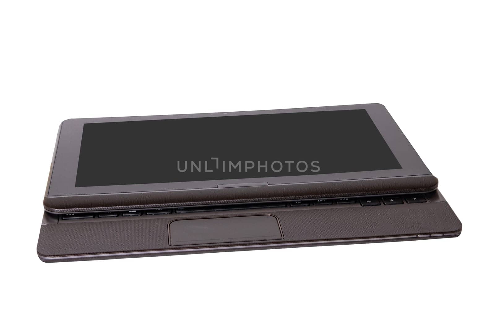 Computer technology background. Close up of modern portable laptop with a dark or black blank screen isolated on a white background.