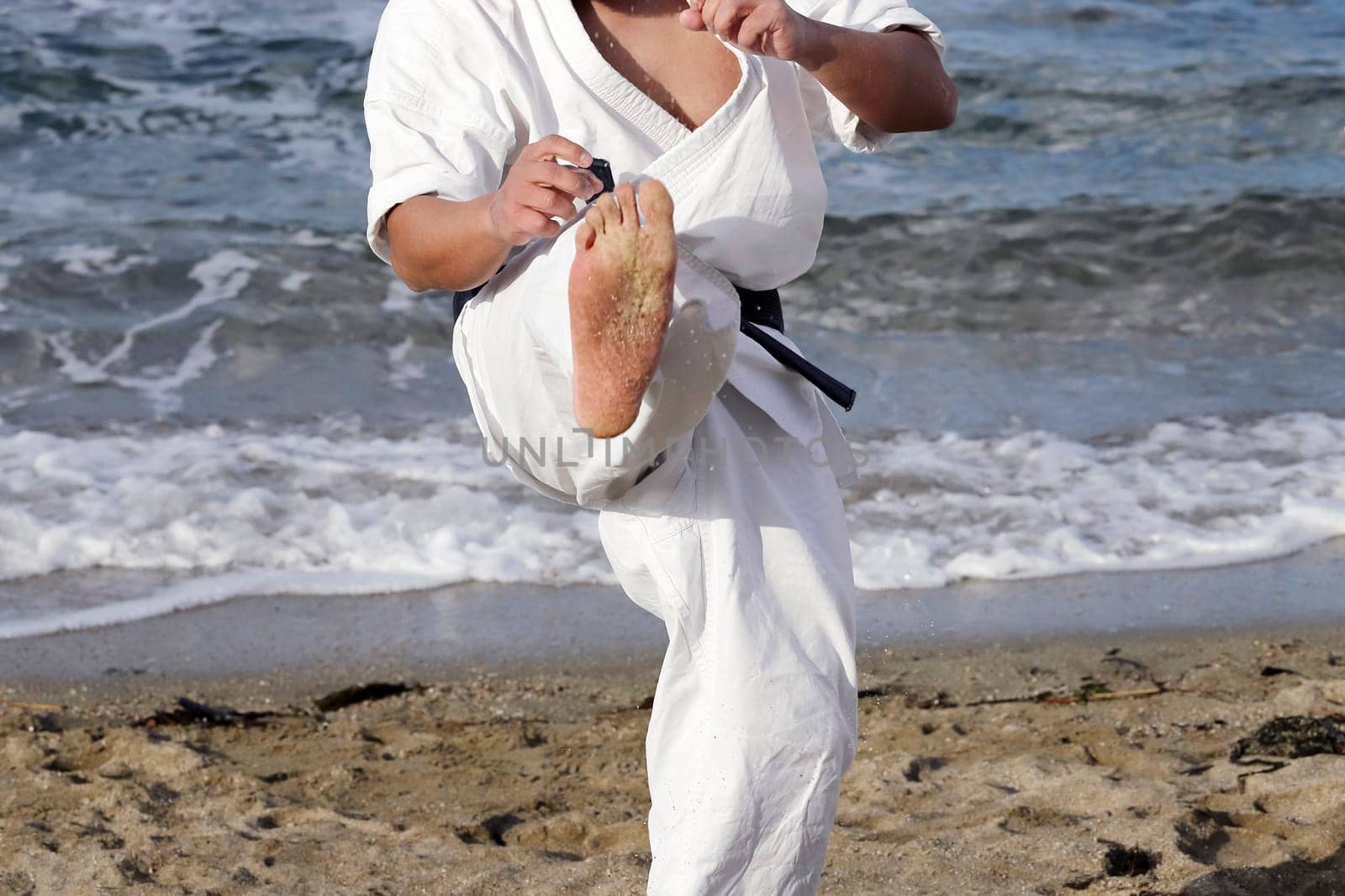 Japanese karate martial arts training at the beach