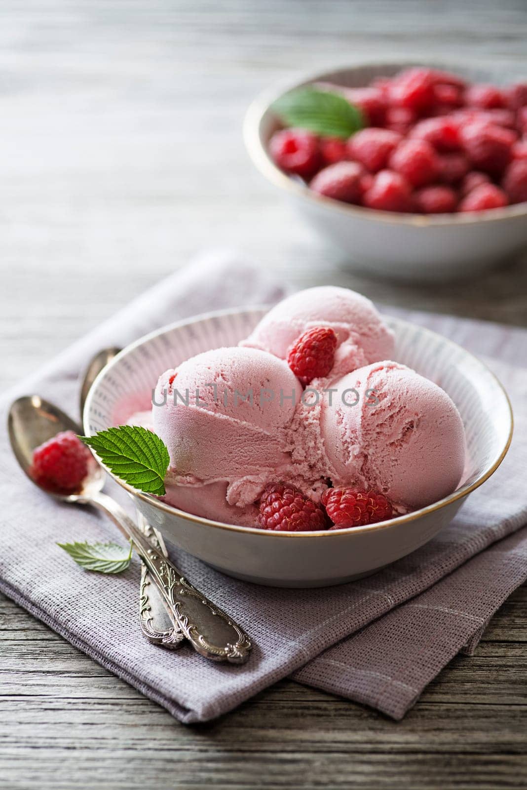 Homemade organic ice cream scoops with berries and raspberry