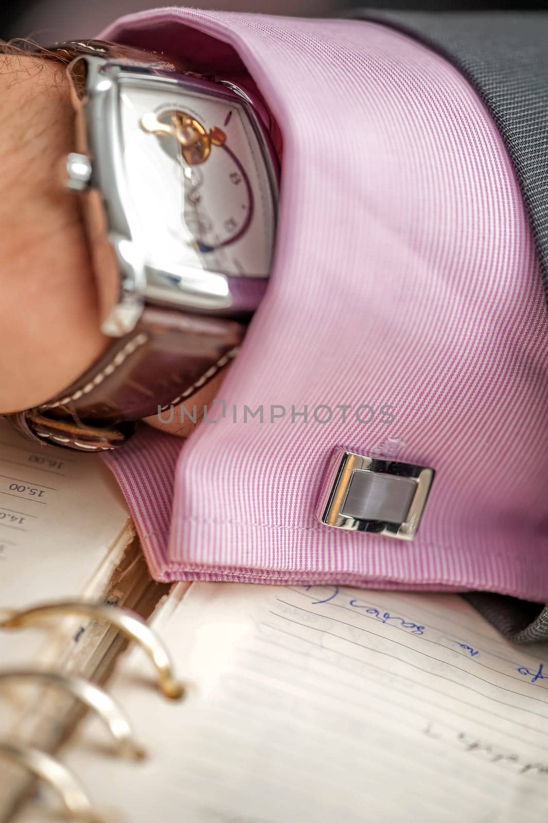 Successful entrepreneur and businessman. Hand of the men conducting the negotiations. Confident man with clock and shirt button on hand. Leader Manager. Expensive watch on a businessman's hand.