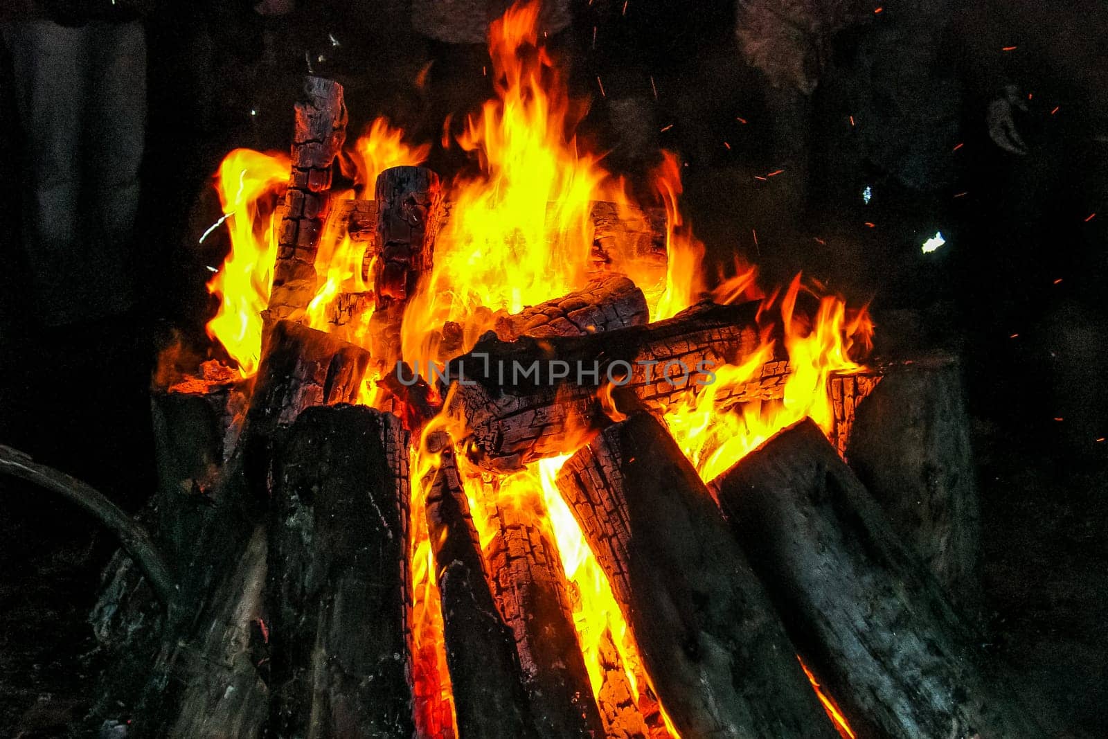 Flames of a campfire in the night. Fire brand.  Camp fire. Tourism in Latvia.