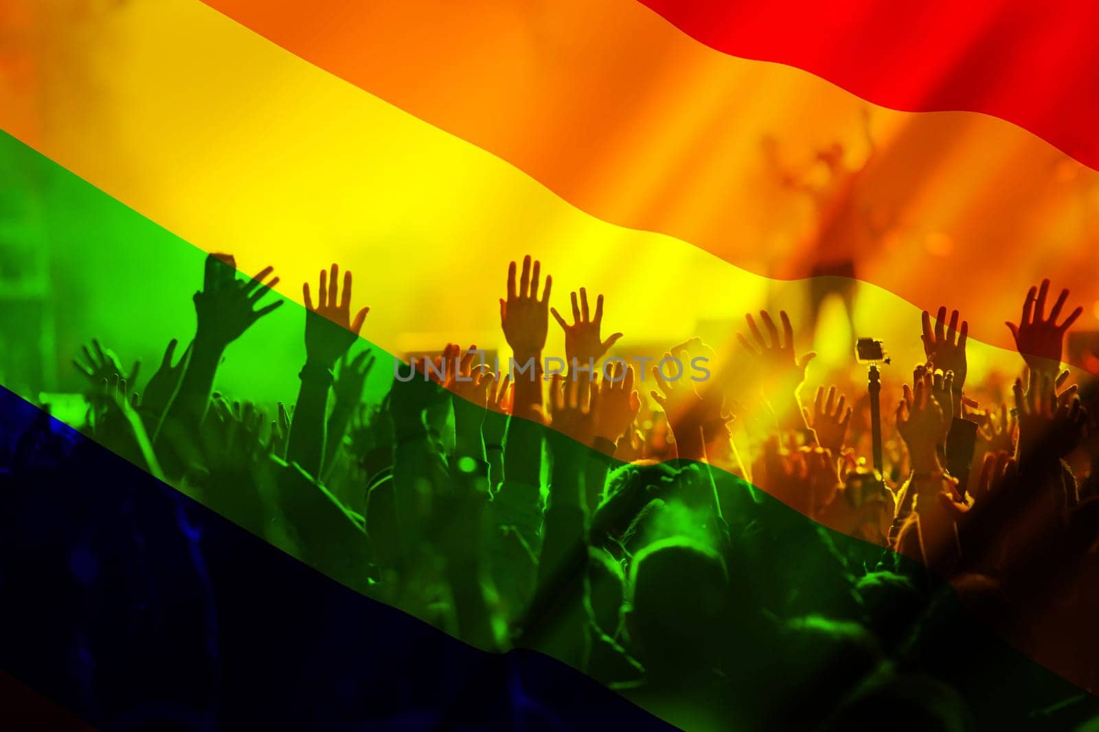 silhouette of a parade of gays and lesbians with a rainbow flag - symbol of love and tolerance