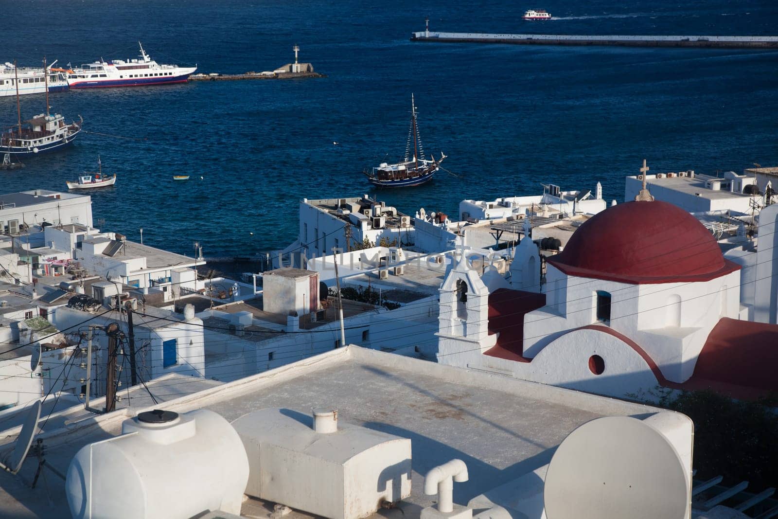 panoramic view of the Mykonos town harbor from the above hills on a sunny summer day, Mykonos, Cyclades, Greece