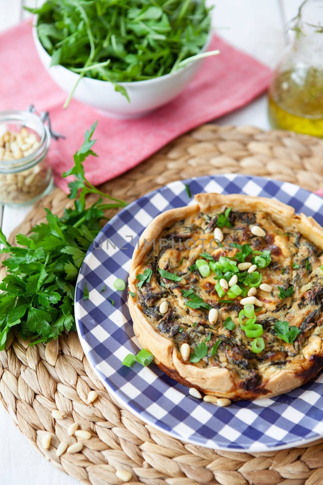 Little quiche with fresh parsley and pine seeds