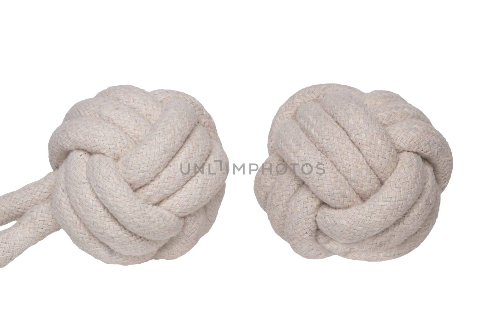 Rope isolated. Close-up of two rope knote balls. Macro. Knoted rope dog toy.