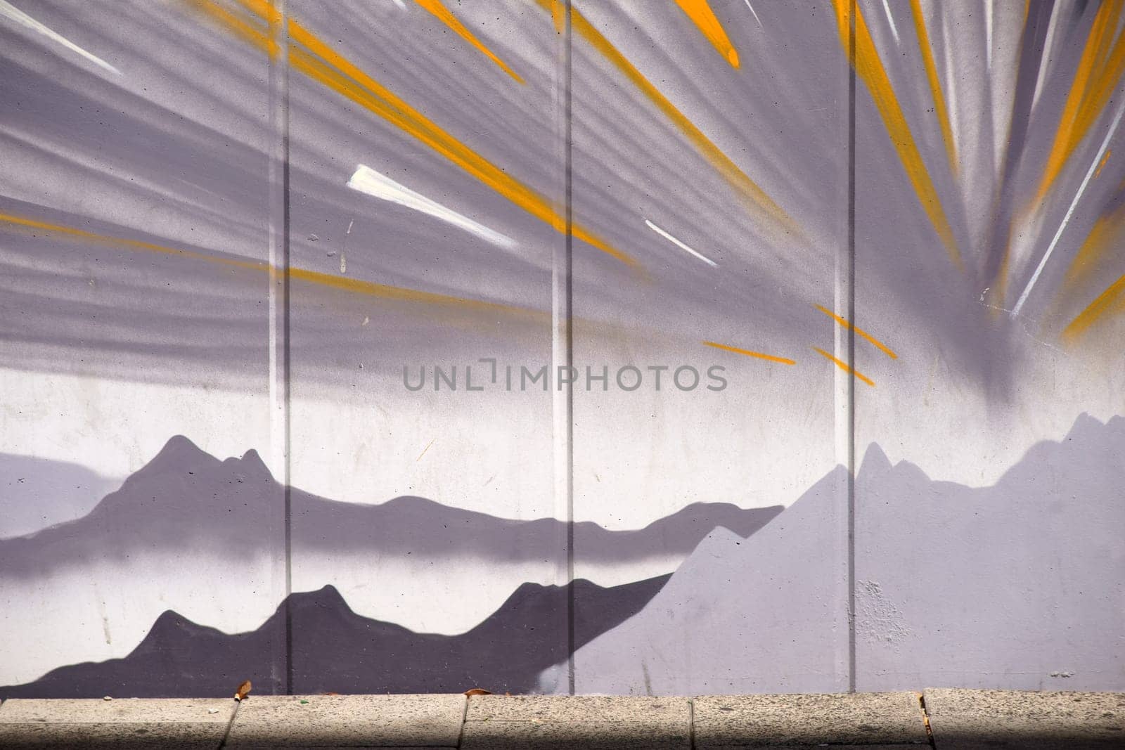 Frankfurt, Germany - August 11, 2018: The drawing of mountains and stylized sunbeams by an unknown artist at Frankfurt Airport on August 11, 2018 in Frankfurt...