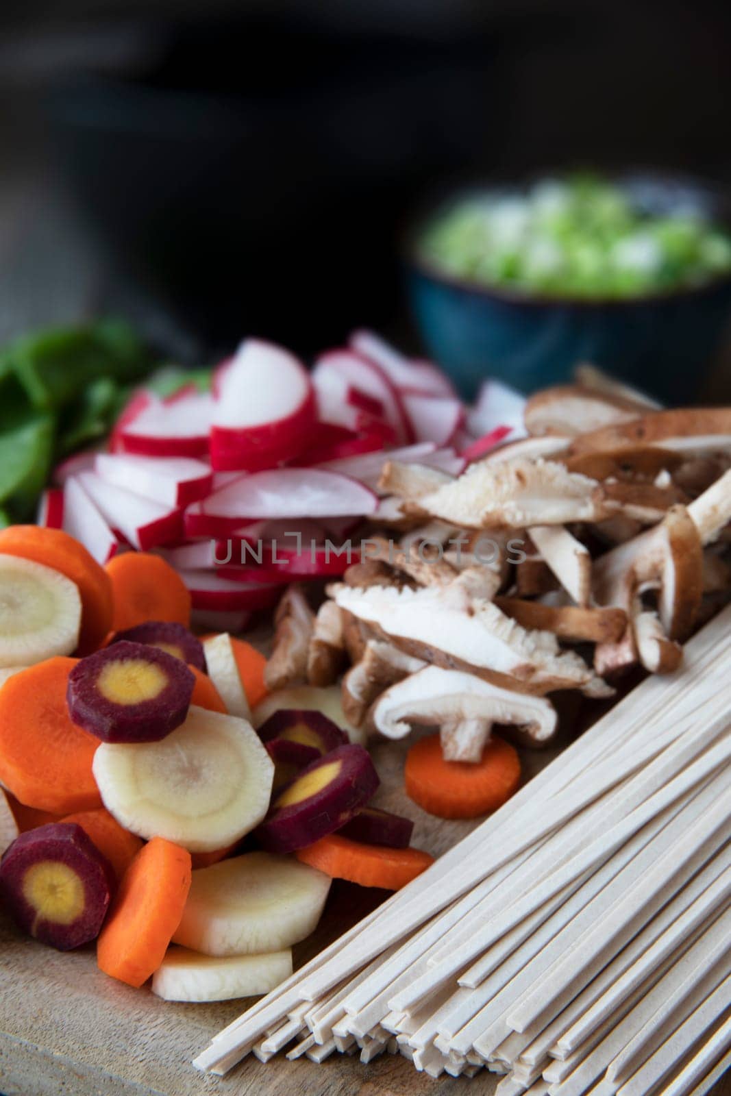 Carrots, shiitakes, radishes, and udon noodles ready for making soup.