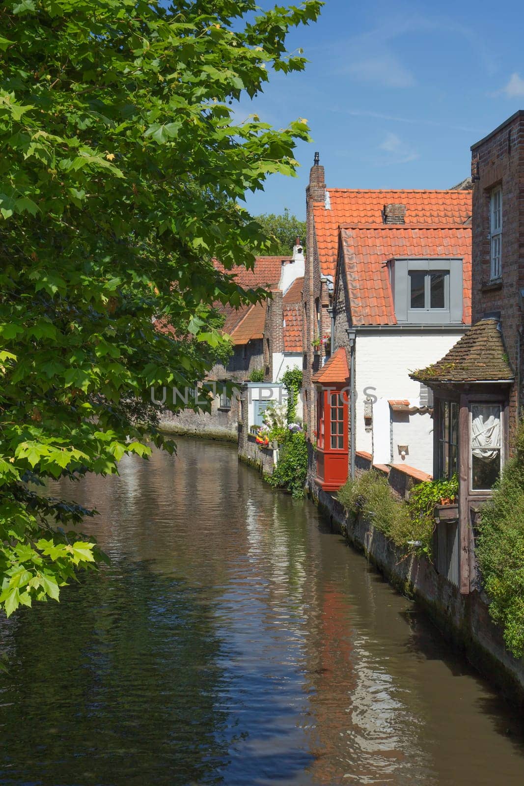 One of the peaceful canals in the downtown of Bruges (Belgium)