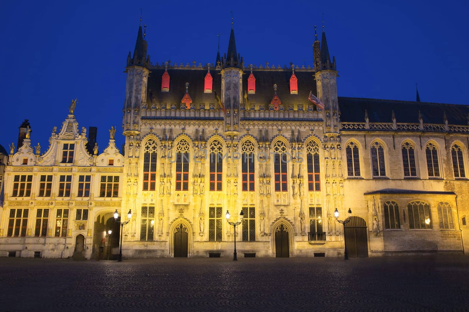 The Town Hall and the Burg Square in Bruges at night (Belgium)