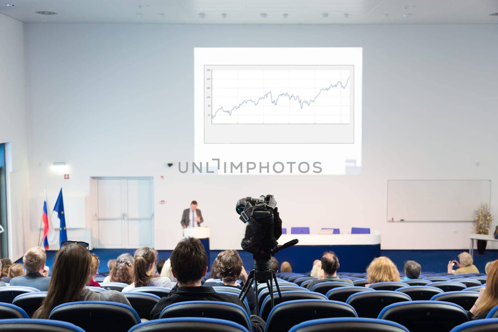 Business Conference and Presentation. Audience at the conference hall. Television broadcasted press conference.