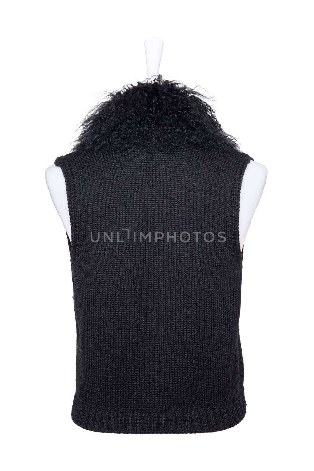 Vest isolated. Black women vest with a large fur collar on mannequin isolated on a white background. Woman fashion. Back view.