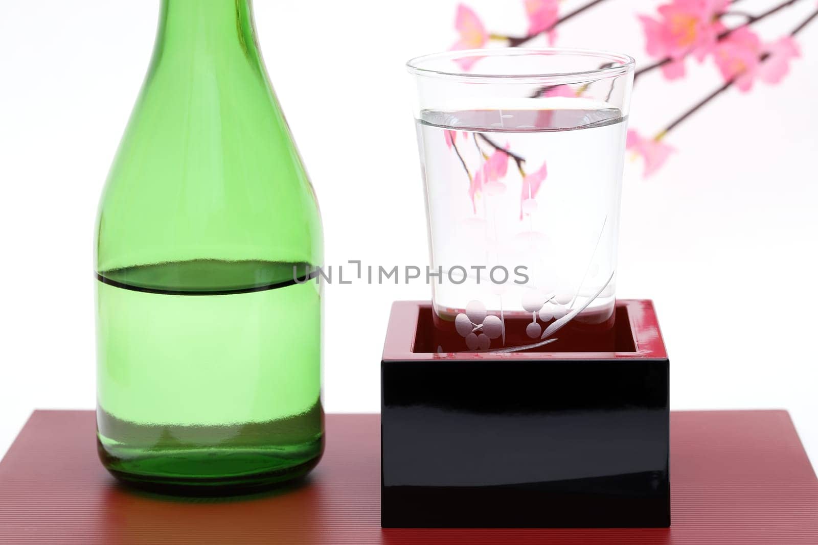 japanese wooden box masu with sake isolated on white background