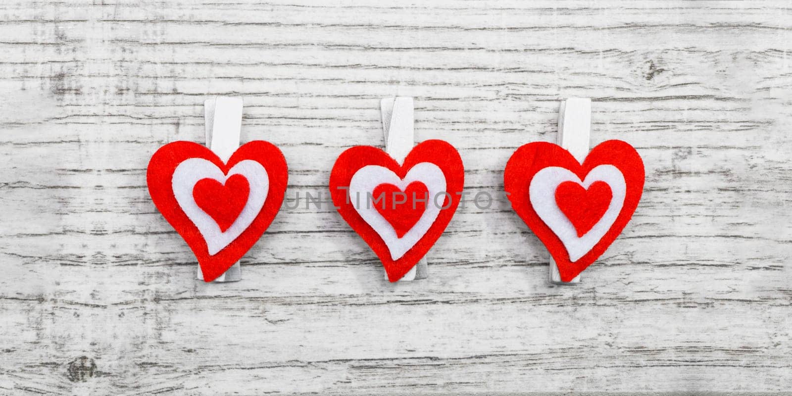 Valentines day with red hearts on wooden background