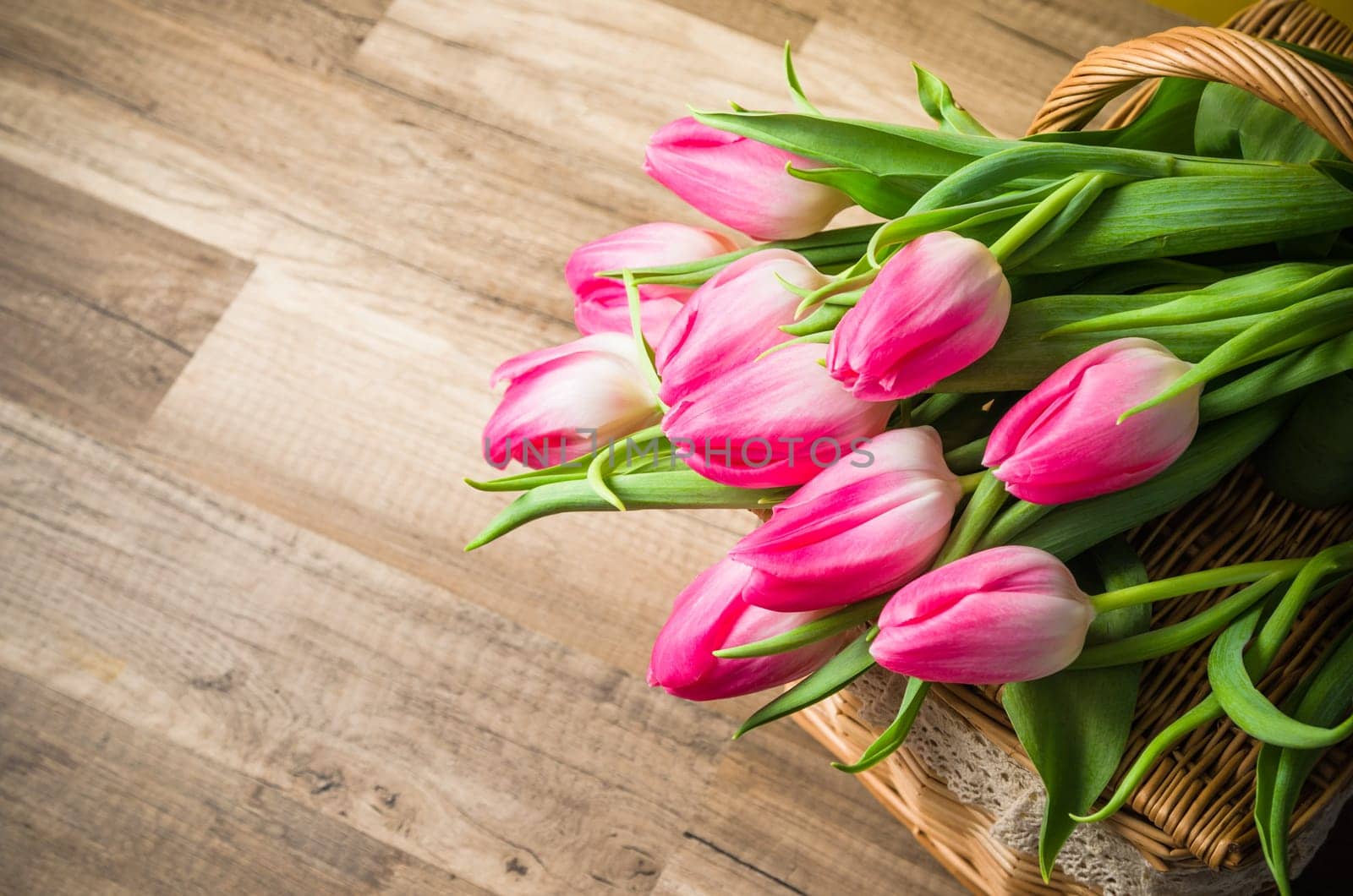 Beautiful bouquet from pink tulips  on a table