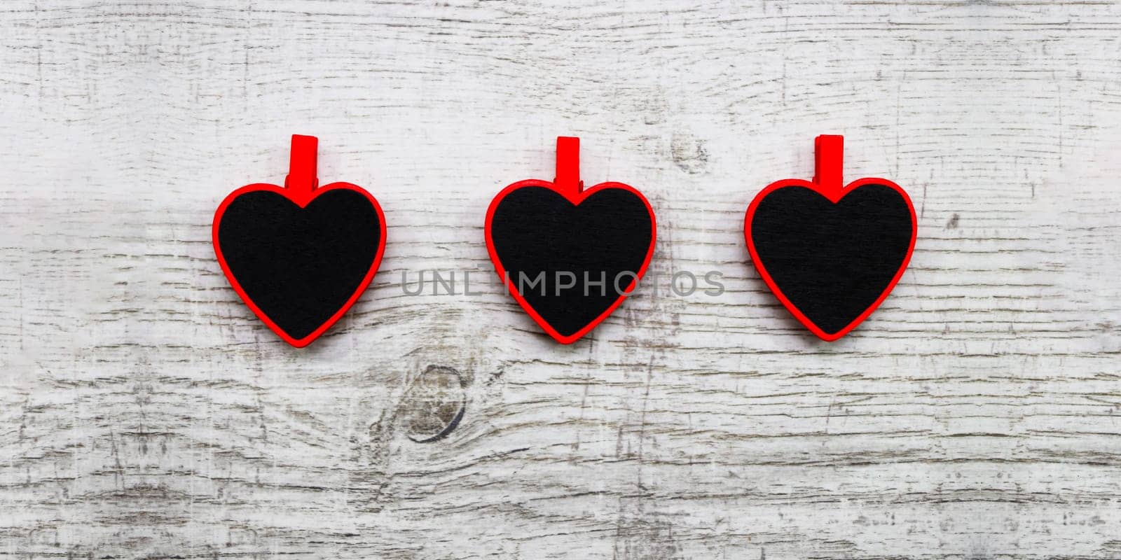 Valentines day with red hearts on wooden background