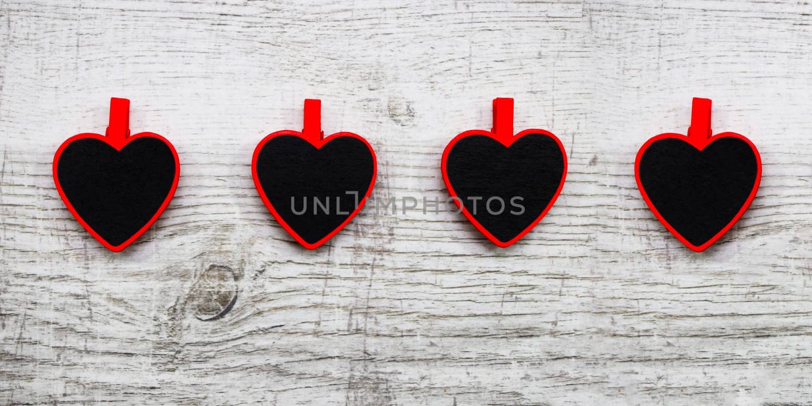 Valentines day with red hearts on wooden background