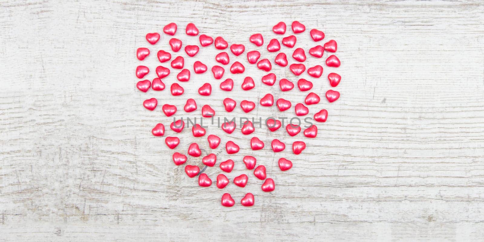 Valentines day with red heart Jellys on wooden background