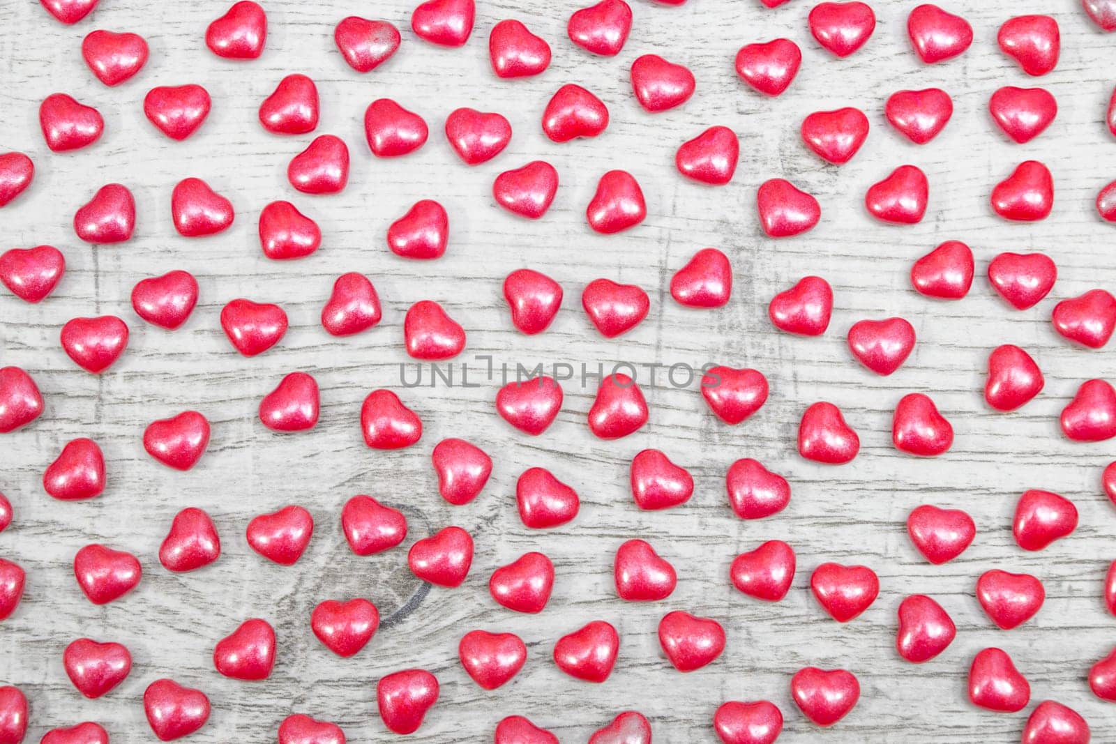 Valentines day with red heart Jellys on wooden background