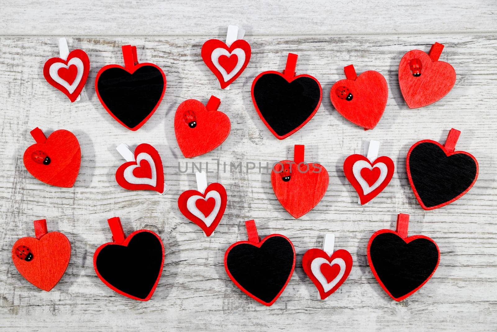 Valentines day with red hearts on wooden background