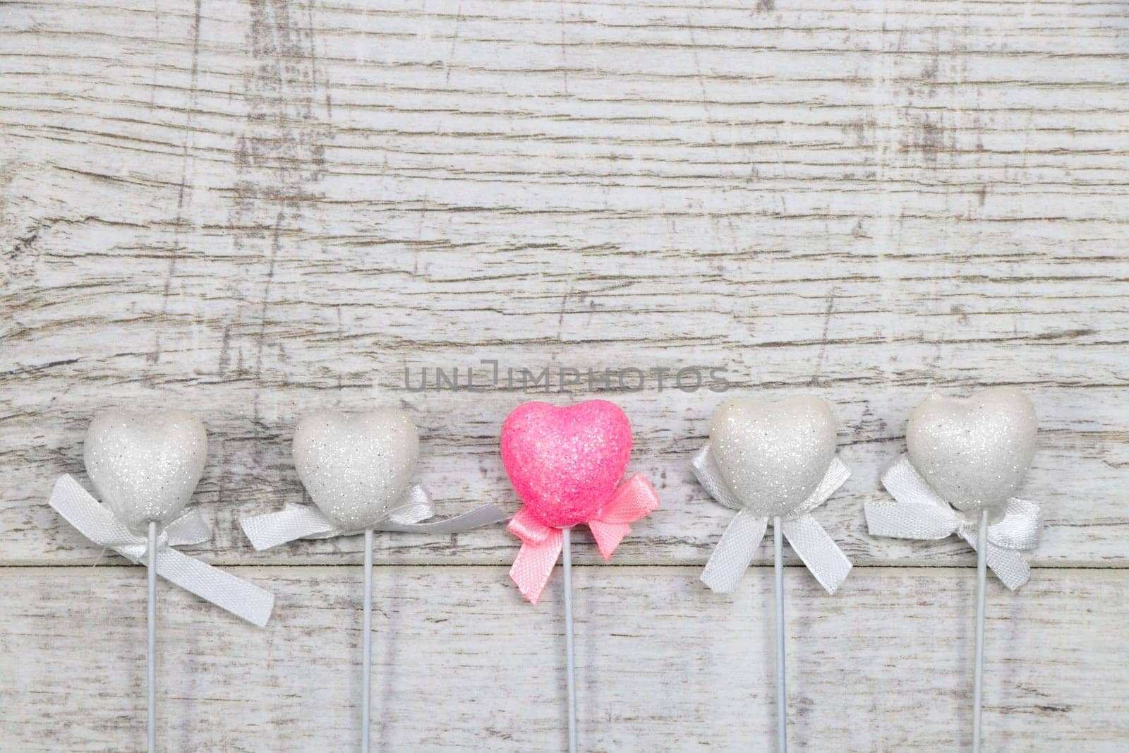 Heart chopsticks on wood background