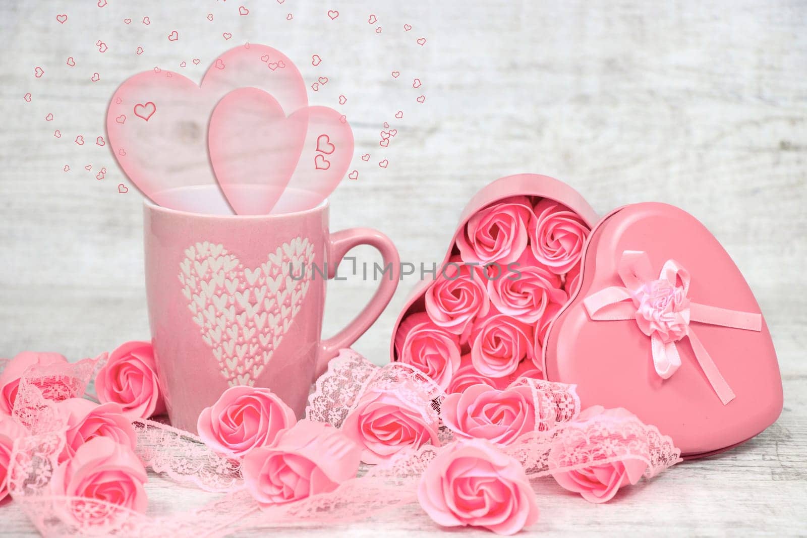 Pink porcelain coffee cup and pink heart roses