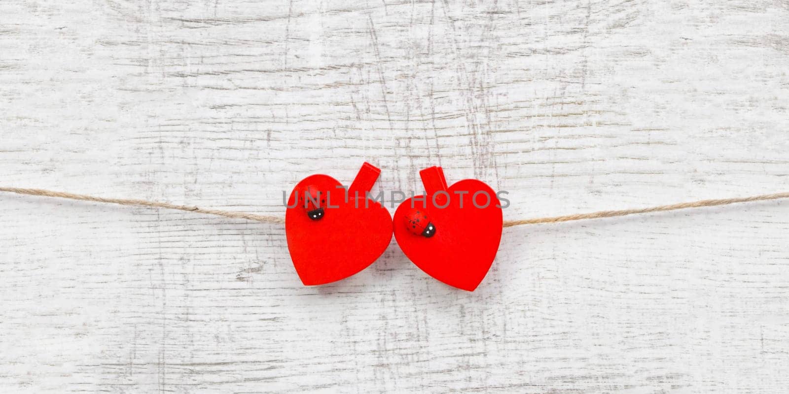 Red hanging hearts with ladybug