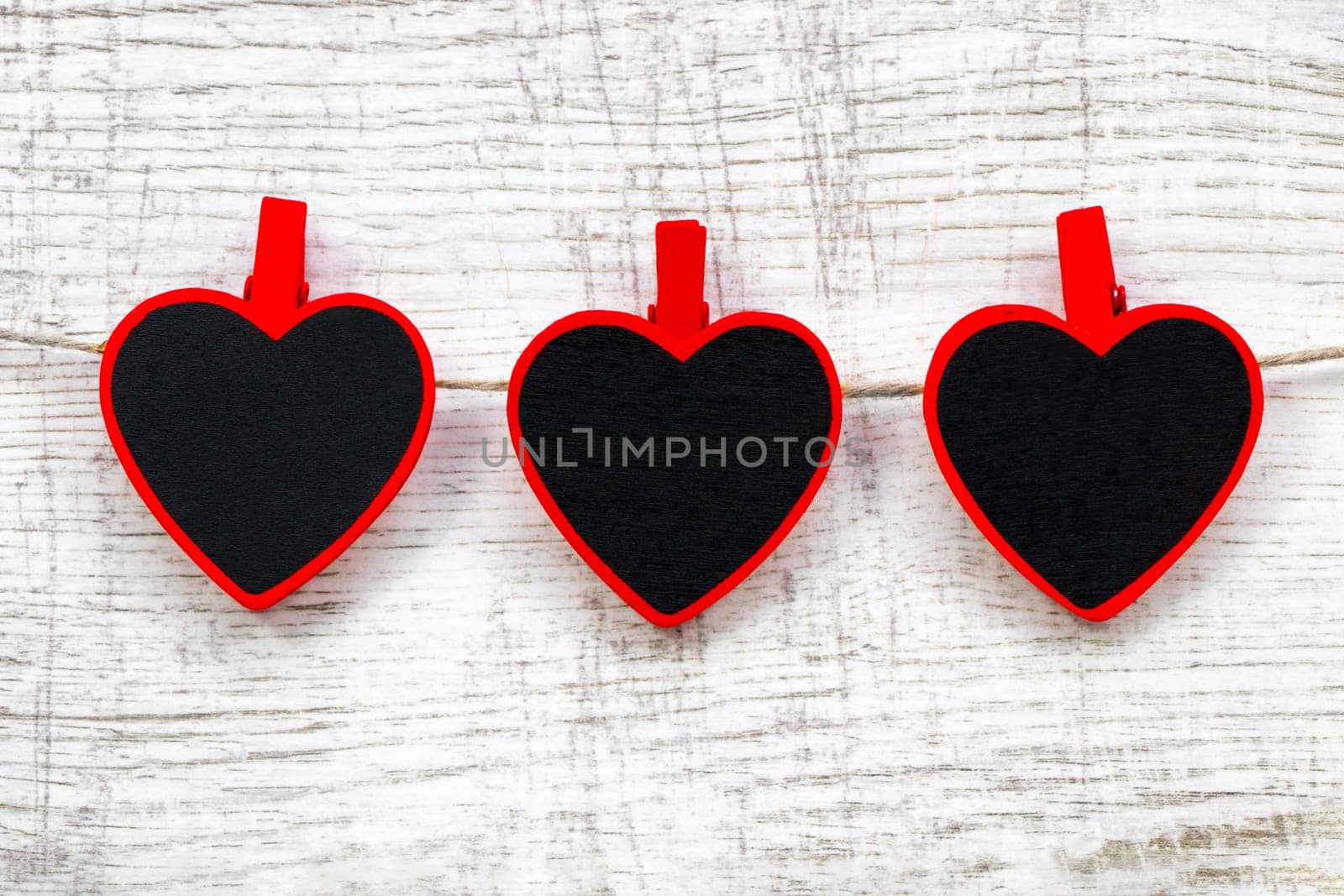 Valentines day with red hearts on wooden background