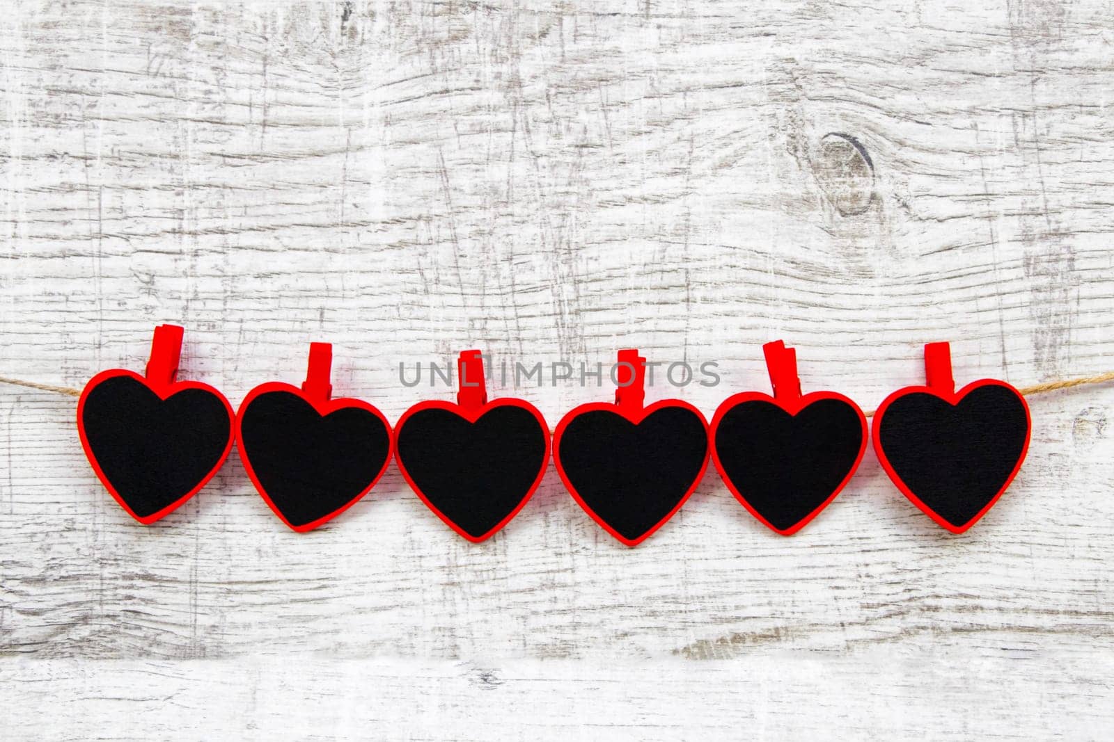 Valentines day with red hearts on wooden background