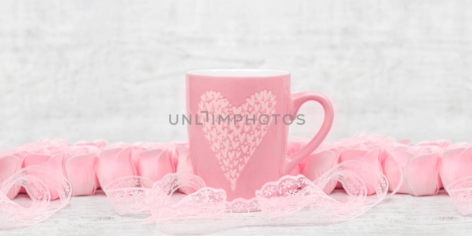 Pink porcelain coffee cup and pink heart roses