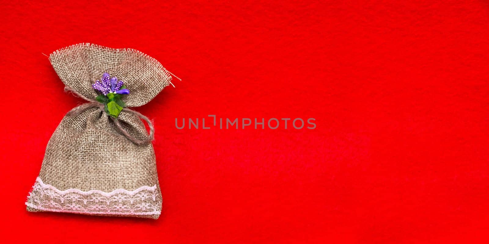 Small gift sack in red background