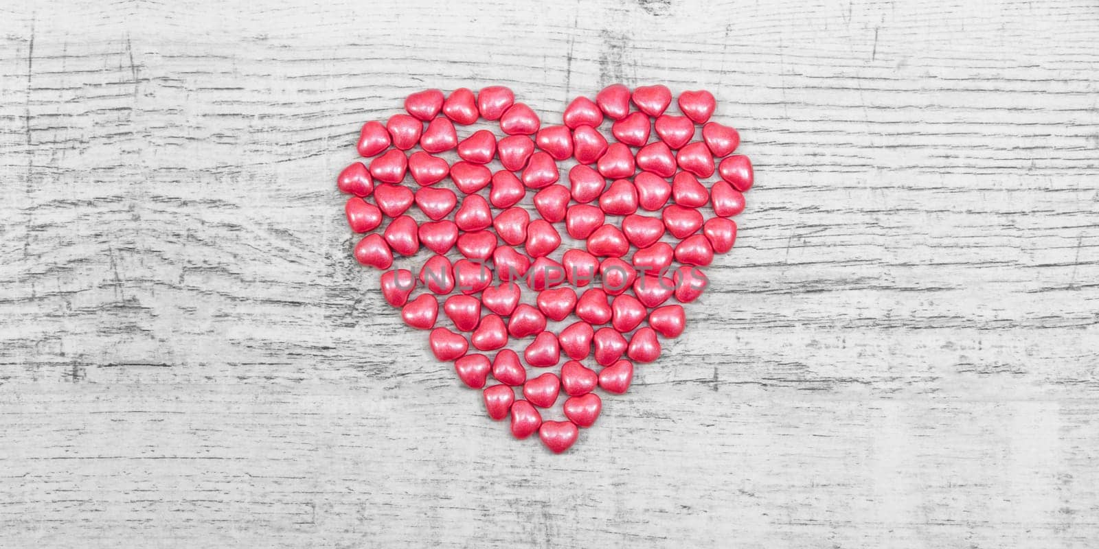 Valentines day with red heart Jellys on wooden background
