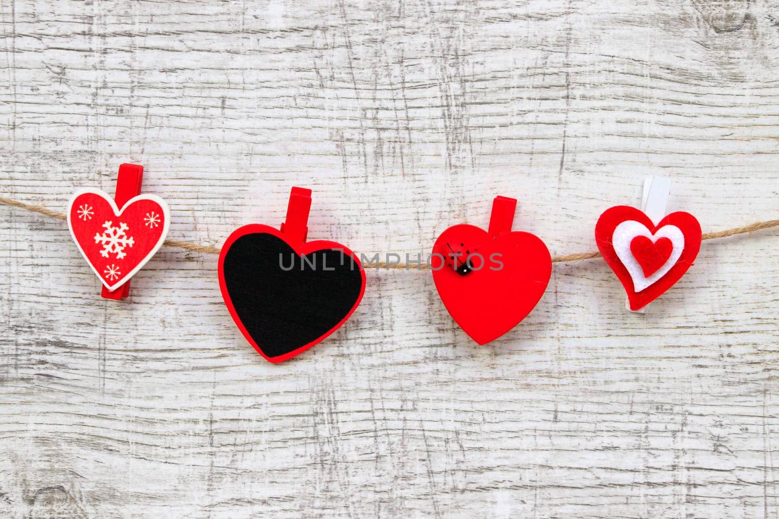 Valentines day with red hearts on wooden background