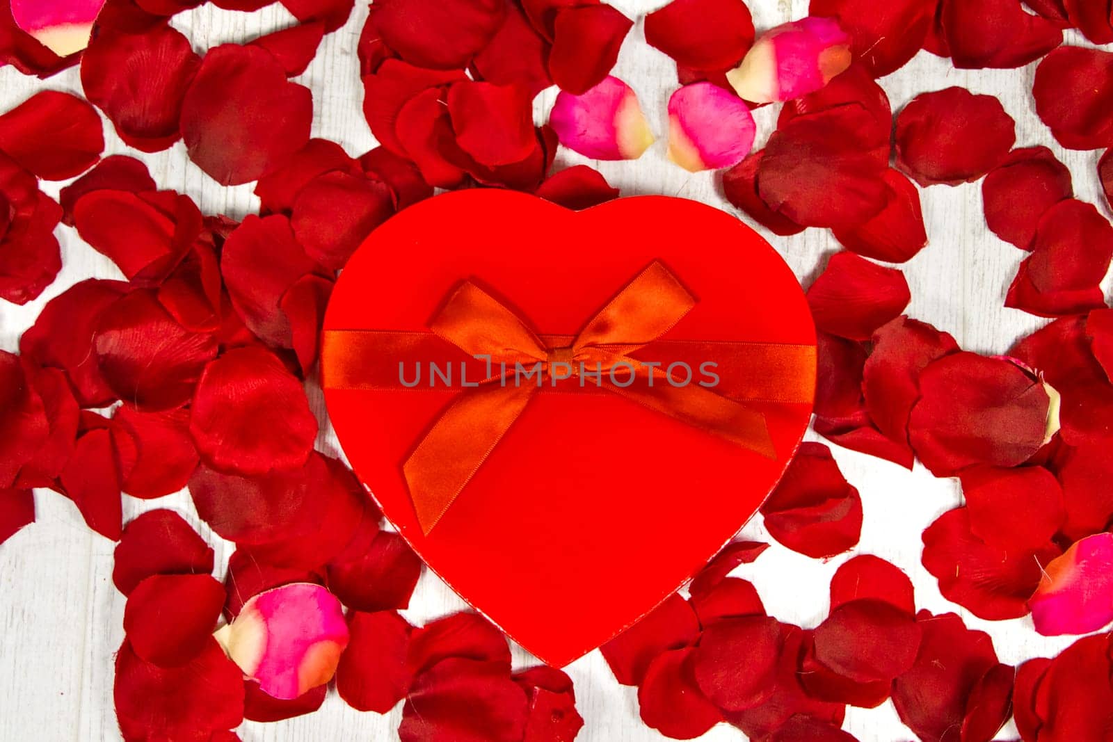 Surprise gift boxes on rose petals, valentines day
