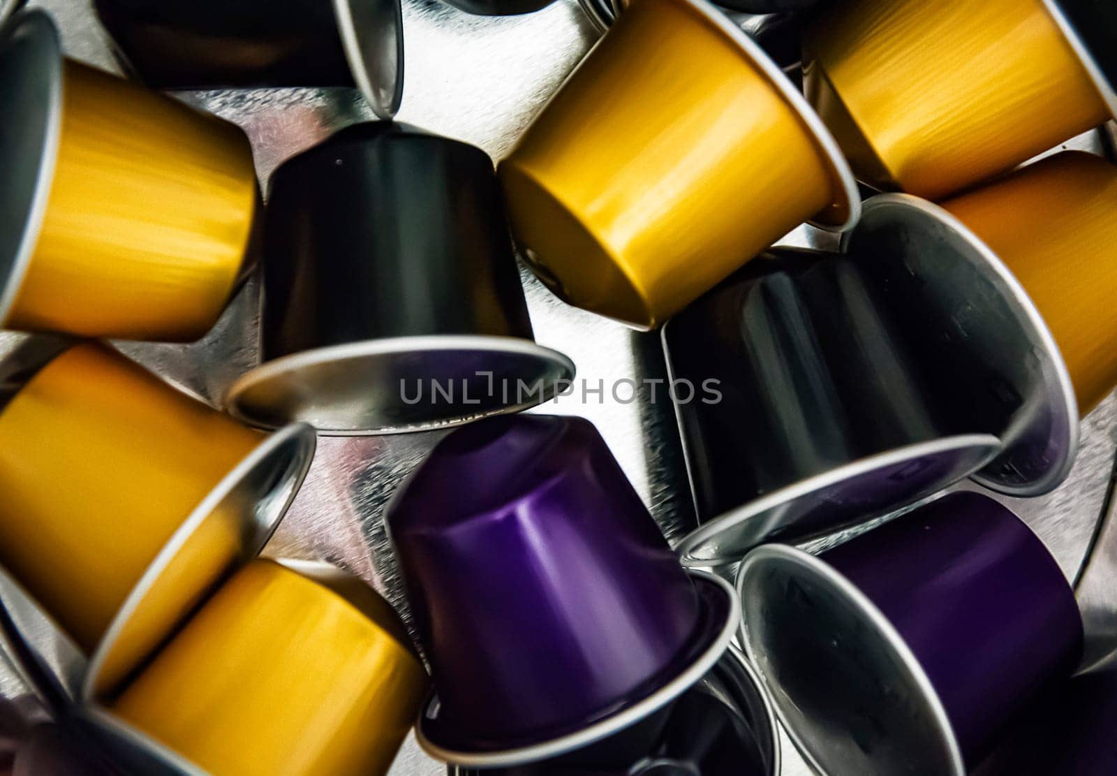 group of espresso coffee capsules in a metallic box