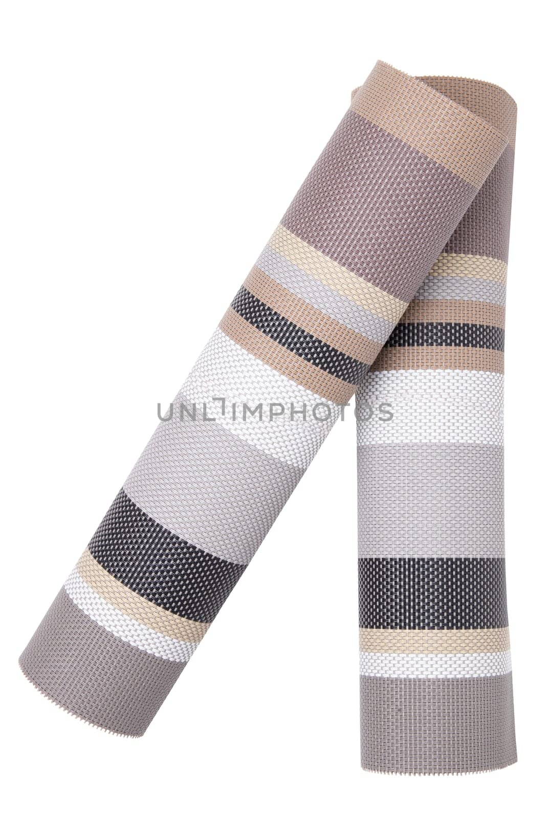Plastic mats backgrounds. Two woven plastic mats with a colorful striped pattern isolated on a white background.