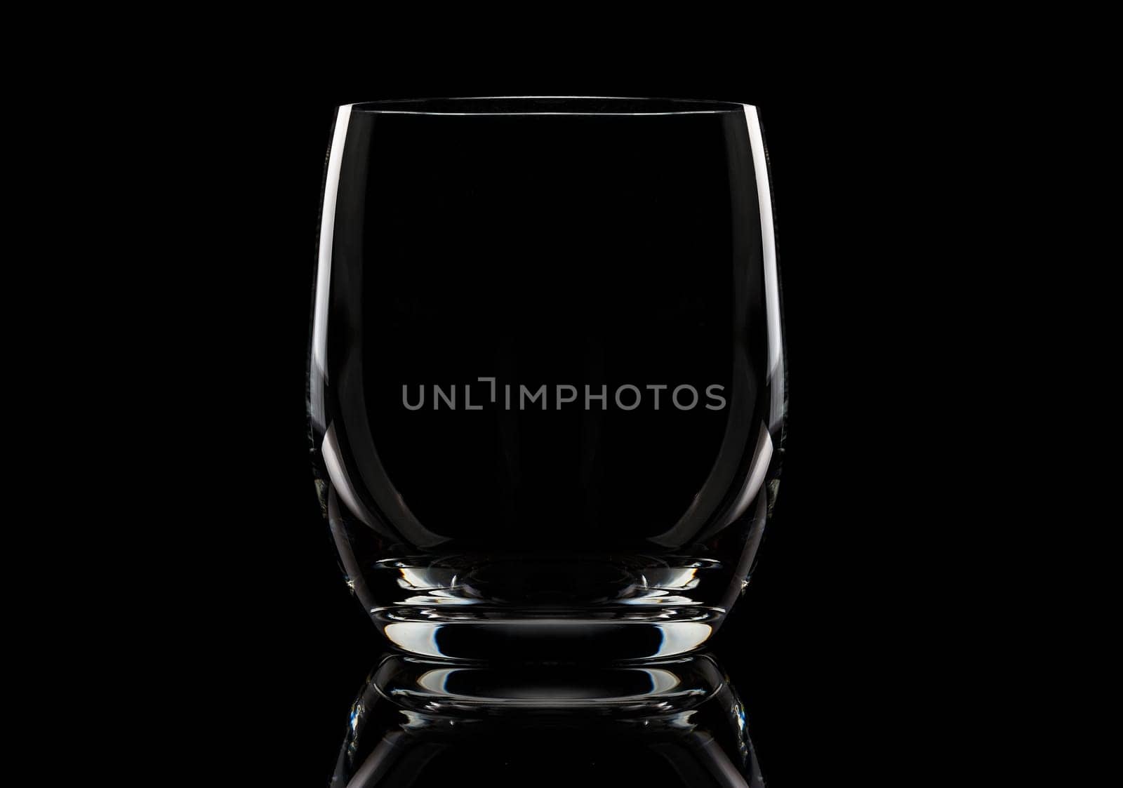 Glass empty glass for juiceGlass empty glass for juice on a black background